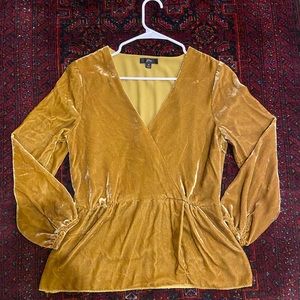 Velvet peplum top in gold